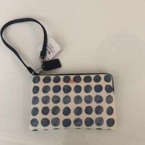 Polka dot Coach wristlet
